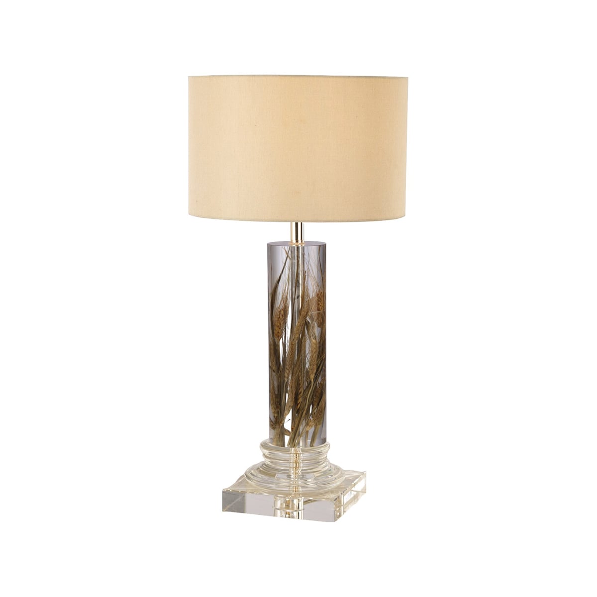 Tall cylindrical acrylic lamp with dried wheat stems inside and shade