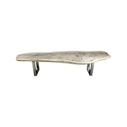 Live-edge suar wood coffee table with washed finish on a stainless steel base