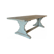 Reclaimed pine dining table in distressed light blue on a trestle base
