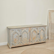 Reclaimed pine carved sideboard with four doors in a distressed light blue finish