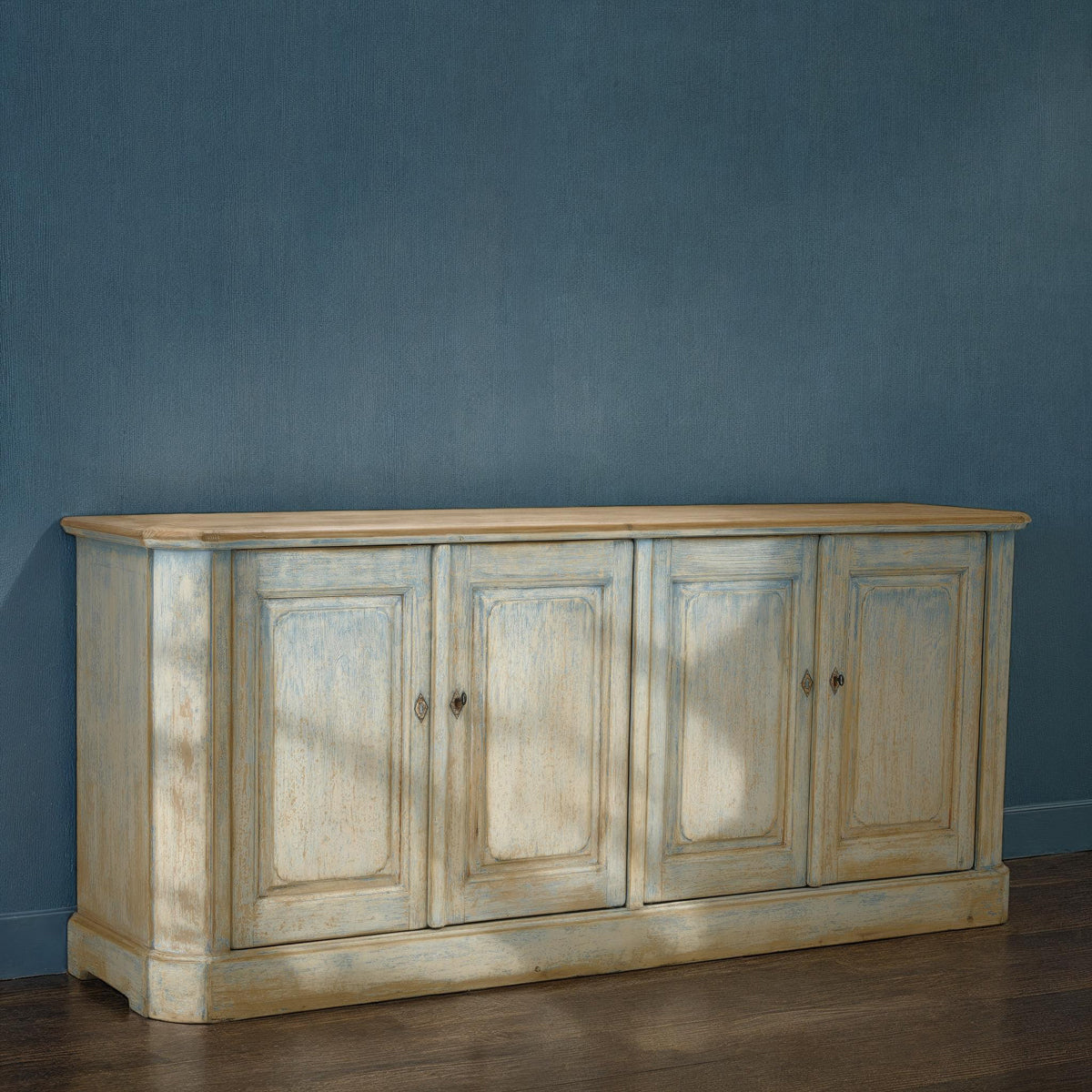 Reclaimed pine sideboard with four paneled doors in a distressed blue finish