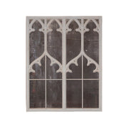 Tall wood mirror with carved Gothic tracery and distressed finish