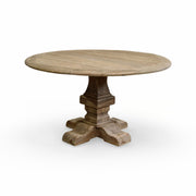 Round reclaimed oak dining table on a substantial pedestal base