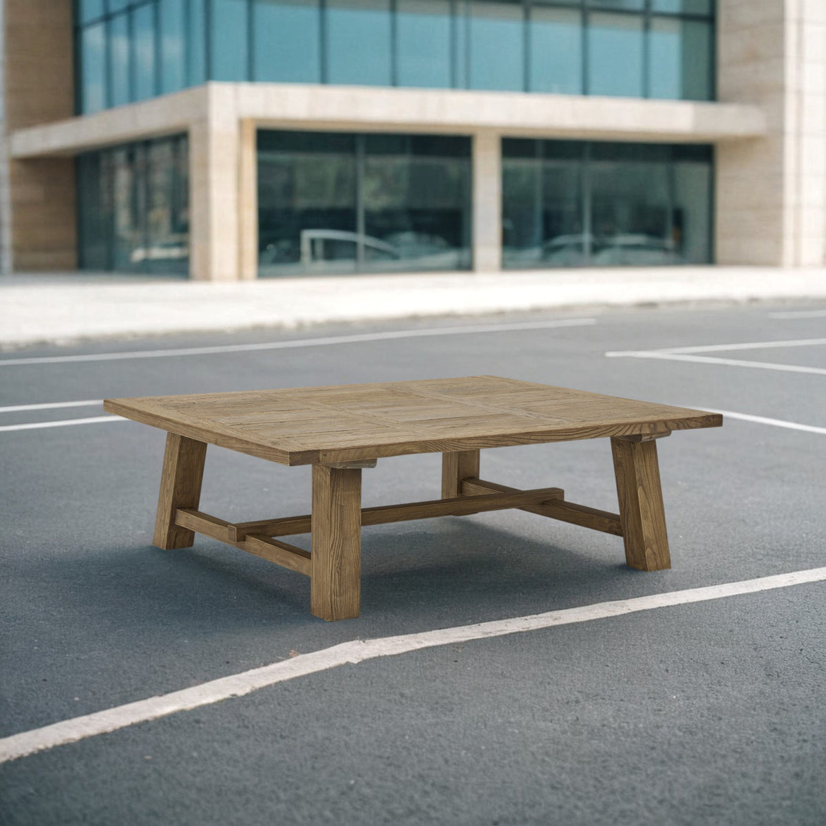 Broad reclaimed oak coffee table on angled legs with stretcher