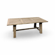Reclaimed oak dining table on a solid stretcher base