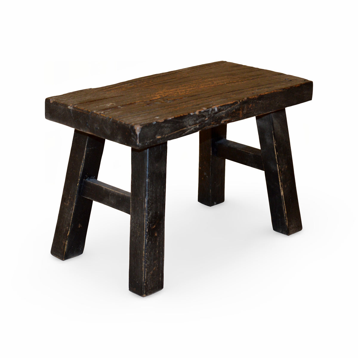 Small stool in elm with a deep black finish and angled legs