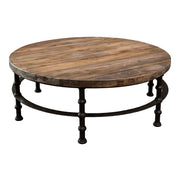 Round reclaimed pine coffee table with plank top on a turned iron base
