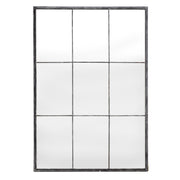 Tall mirror in a slender iron frame with a divided grid layout