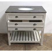 Single vanity with stone top, circular sink opening, three drawers, and open shelf