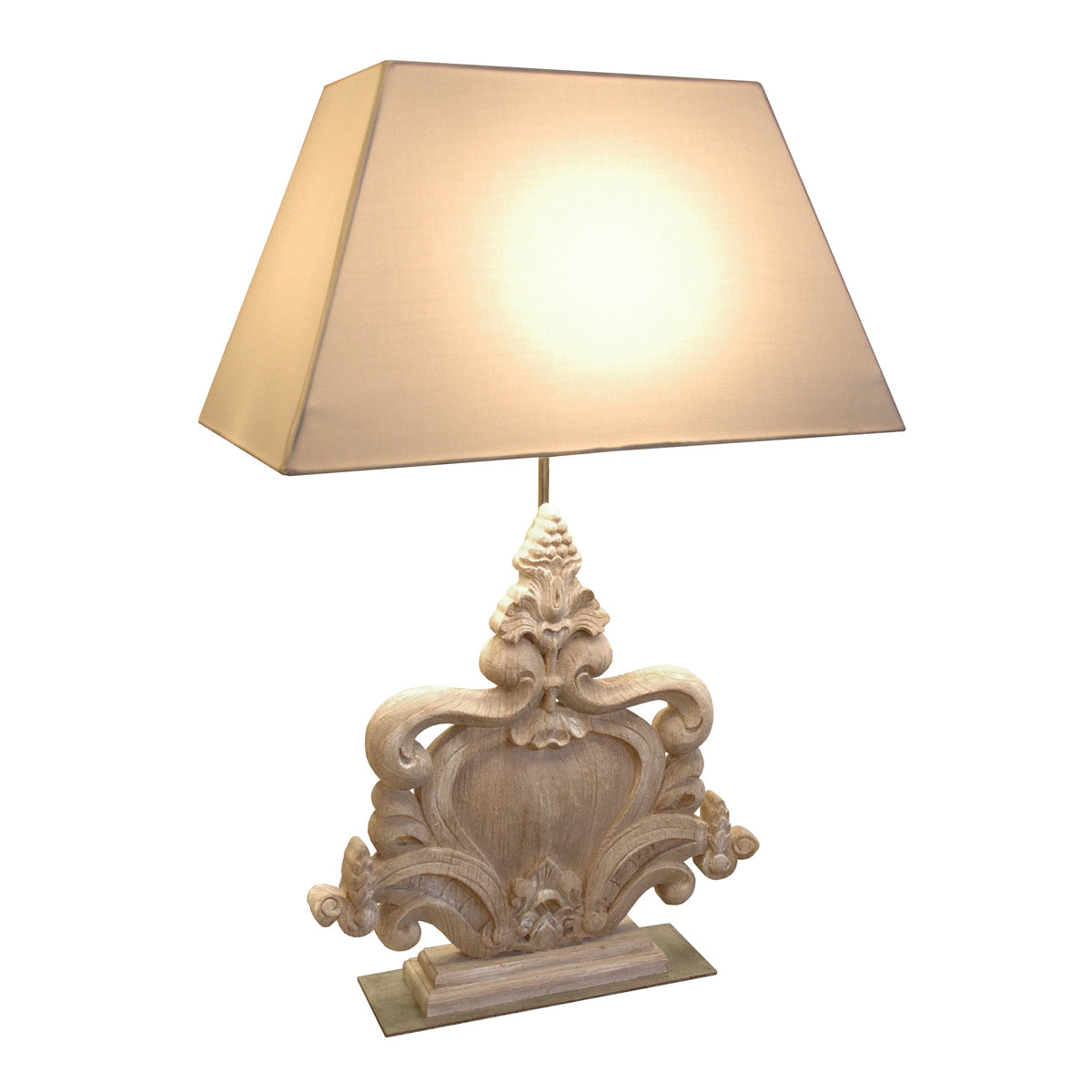 Bergerac table lamp with carved horizontal base, shield motif and shade