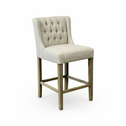 Ecru linen wing-back counter stool on an oak frame with a chrome back handle
