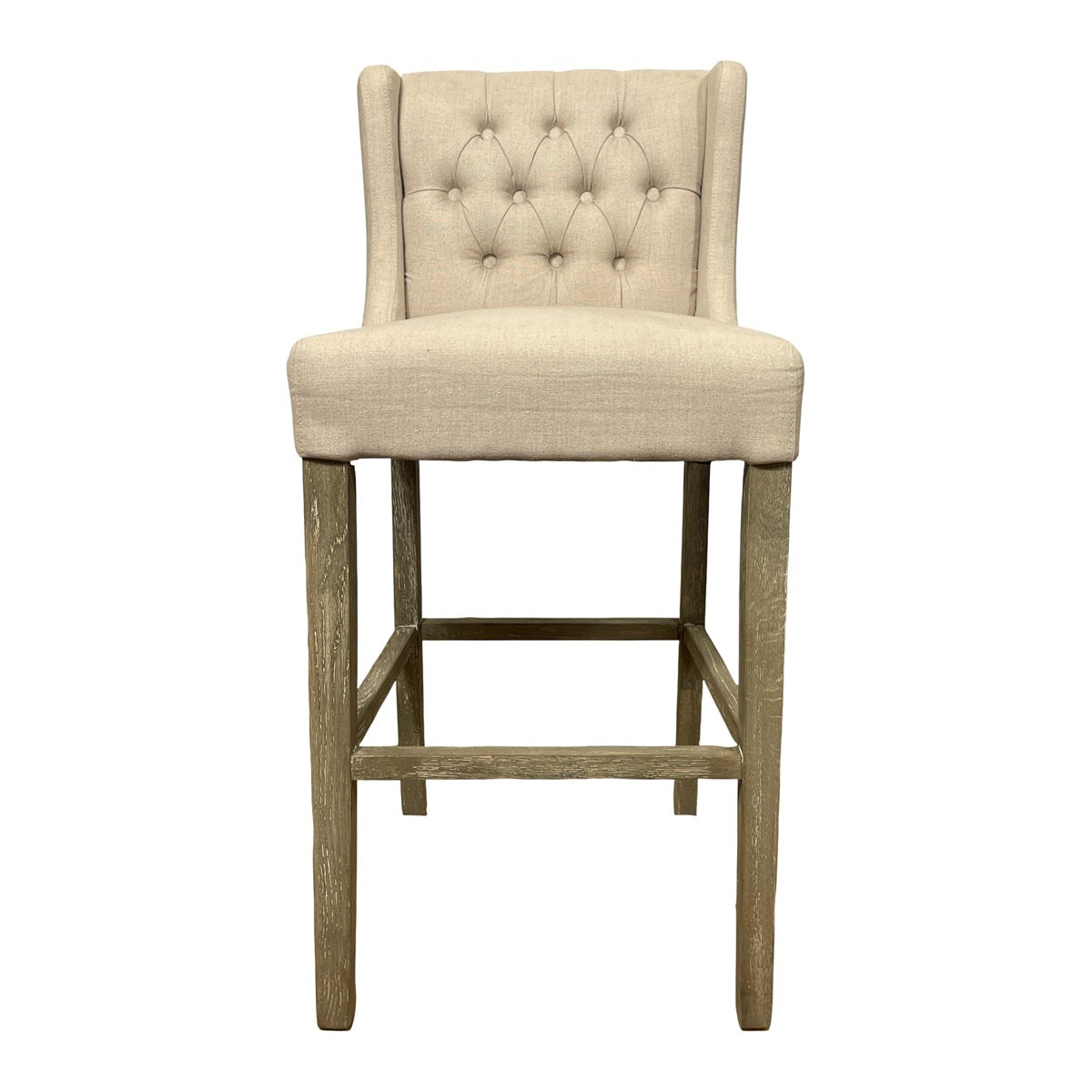Wing-back barstool upholstered in ecru linen on a wood frame