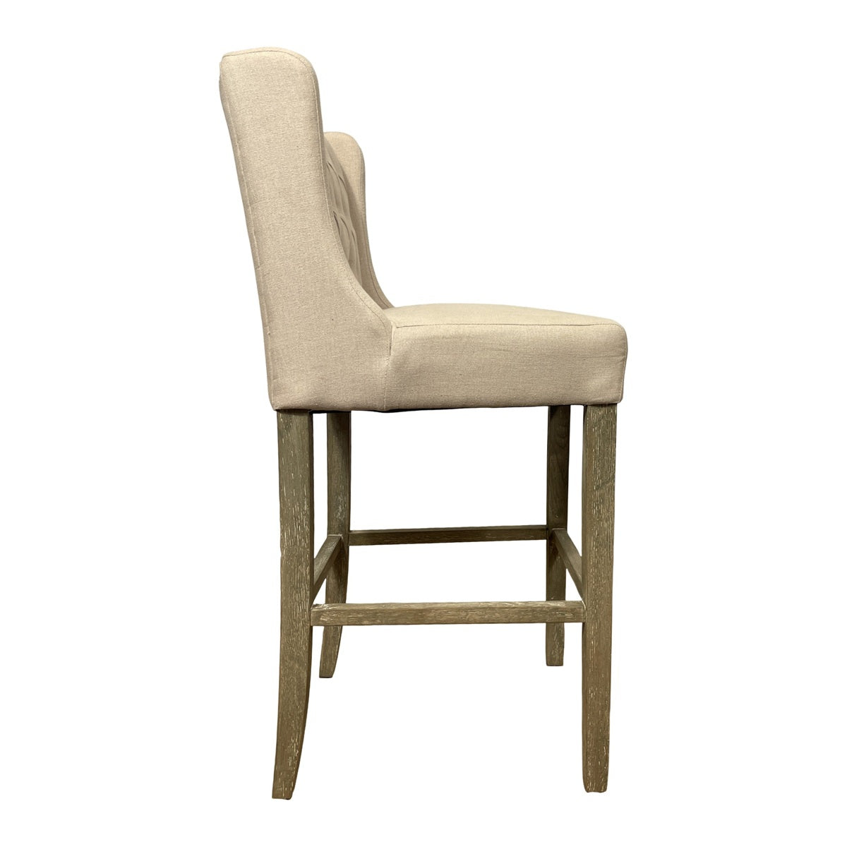 Wing-back barstool upholstered in ecru linen on a wood frame