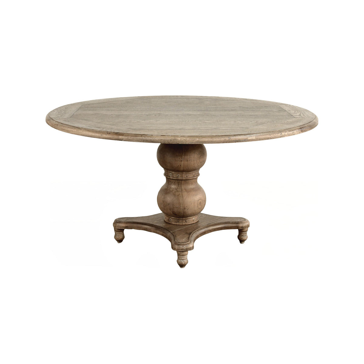 Round oak dining table on a turned pedestal base