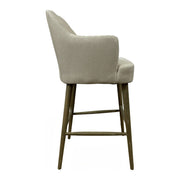 Ecru linen bar stool with arms and channeled back on a wood frame