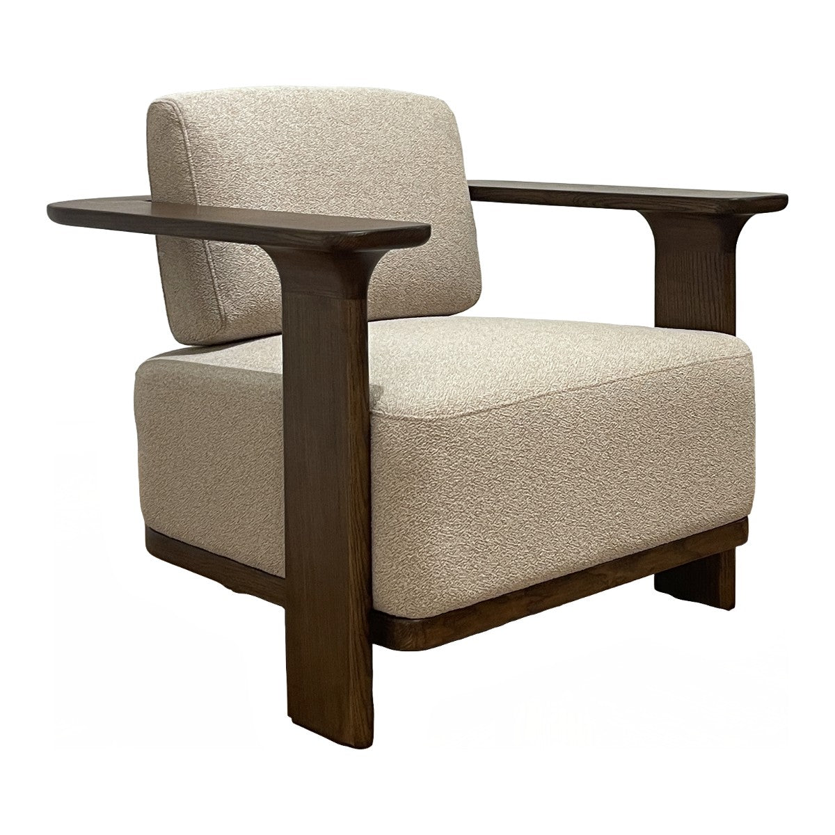 Low upholstered accent chair with wide arms on an ashwood frame