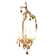 Iron wall sconce with branching arms, candle sockets and antique rust finish