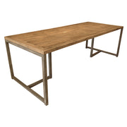 Reclaimed-wood dining table with washed finish on a slim metal base