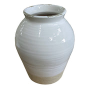 Small rounded terracotta vase with a light opaque finish