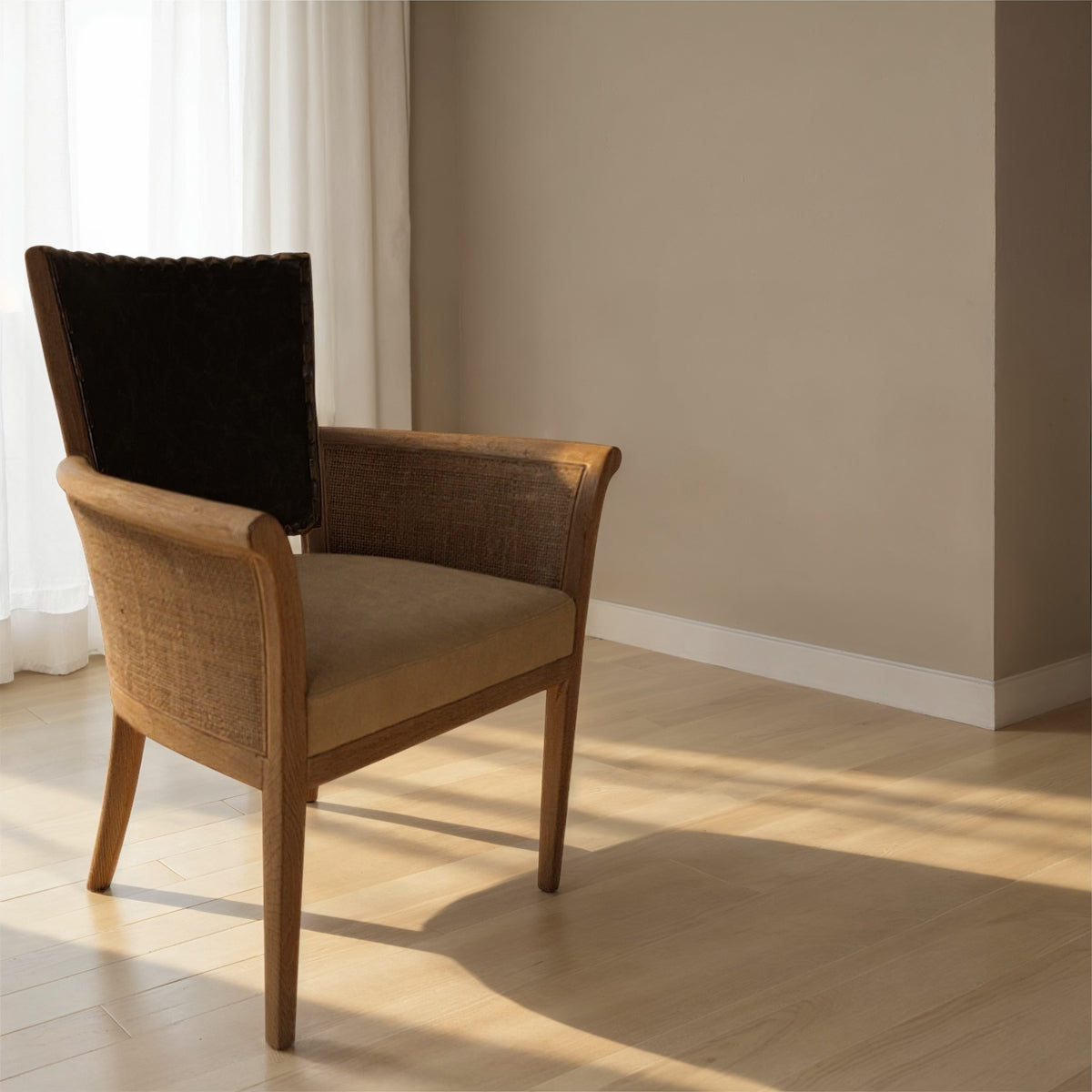 Dining arm chair with a black leather back and woven side panels on an oak frame