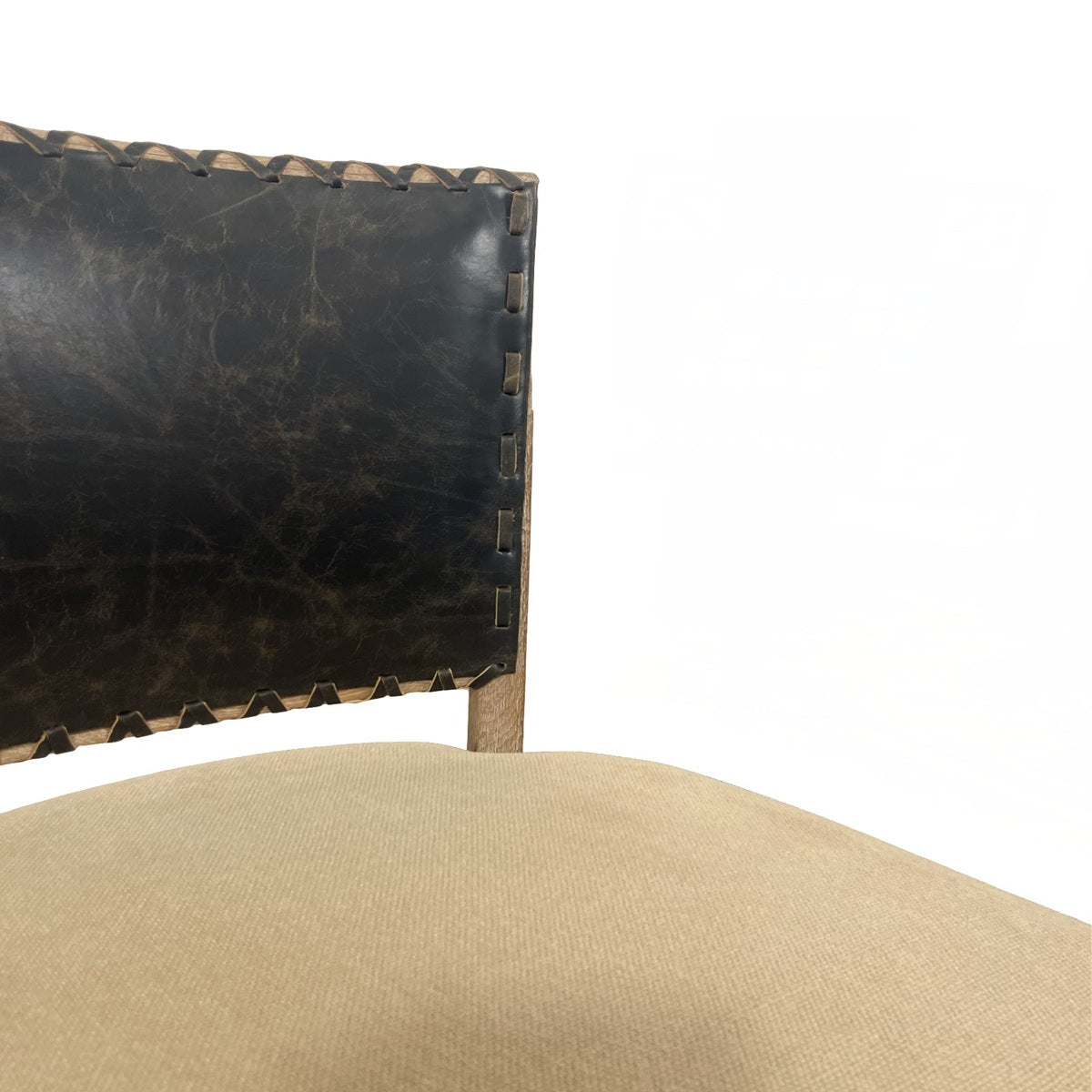 Side chair with a black leather back and upholstered seat on an oak frame