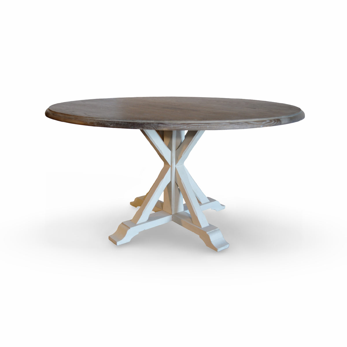 Round oak dining table in light burnt finish on an intersecting base