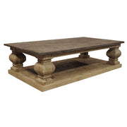 Reclaimed pine coffee table with stone top, pedestal supports and lower shelf