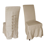 Slipcovered dining chair with a back bow detail on a white oak frame