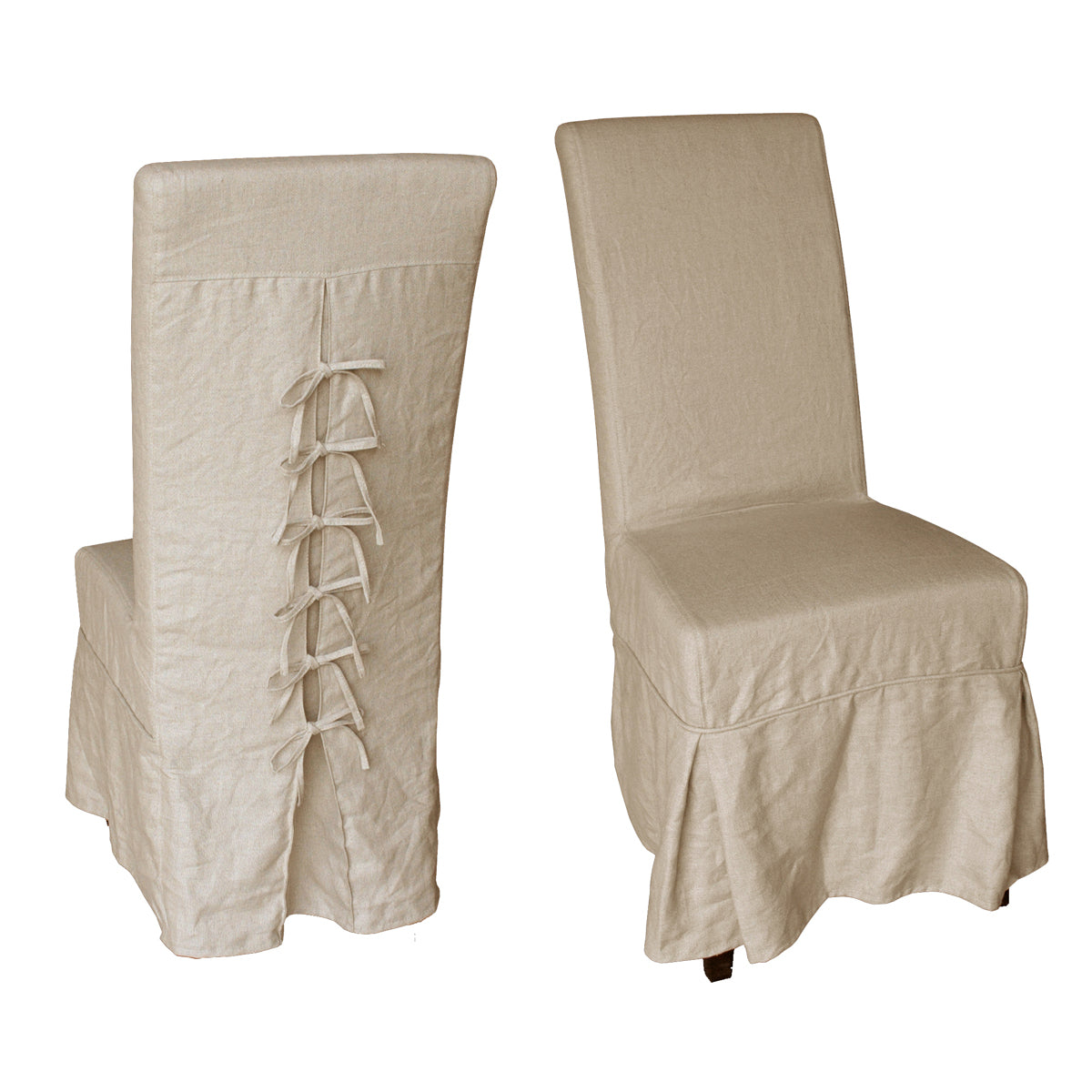 Slipcovered dining chair with a back bow detail on a white oak frame