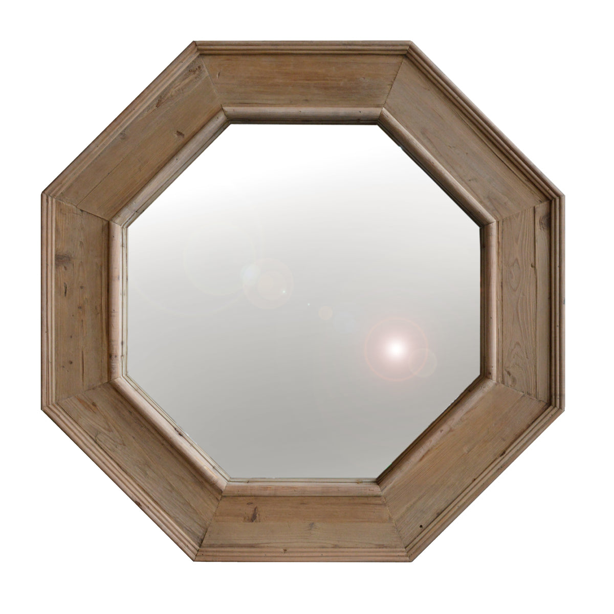 Octagonal mirror framed in reclaimed pine with visible grain