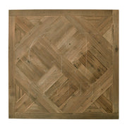 Reclaimed pine flooring arranged in parquet squares with visible grain and wear