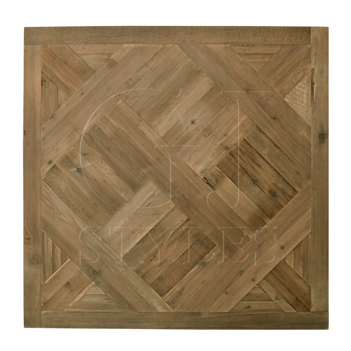 Reclaimed pine flooring arranged in parquet squares with visible grain and wear