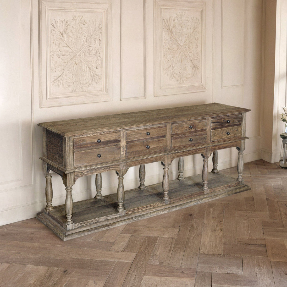 Reclaimed elm console table with eight drawers on turned supports