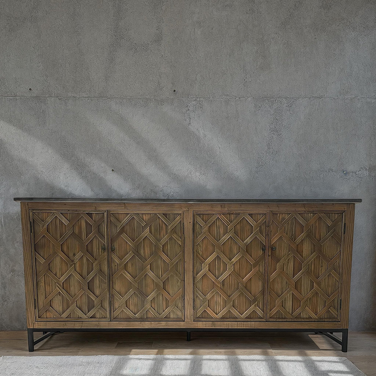 Reclaimed elm server with diamond-embossed door panels on a metal base