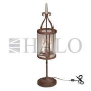 George table lamp with lantern-style enclosure and antique rust finish