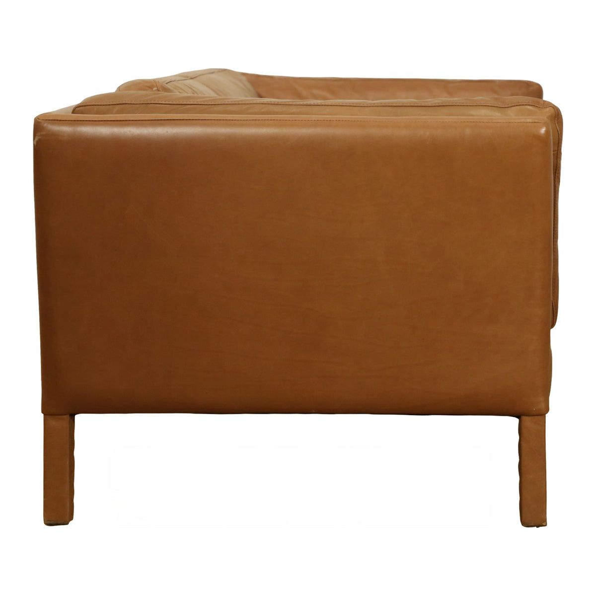 Reggio two-seater sofa in soft Old Saddle Nut leather with a relaxed silhouette
