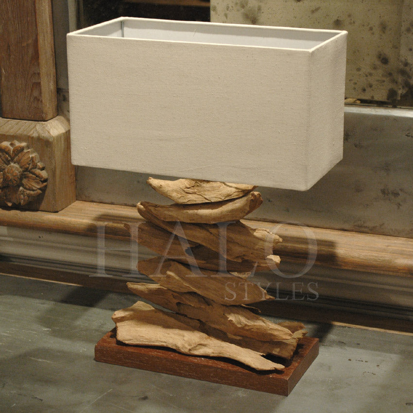 Driftwood table lamp with stacked wood body and white rectangular shade