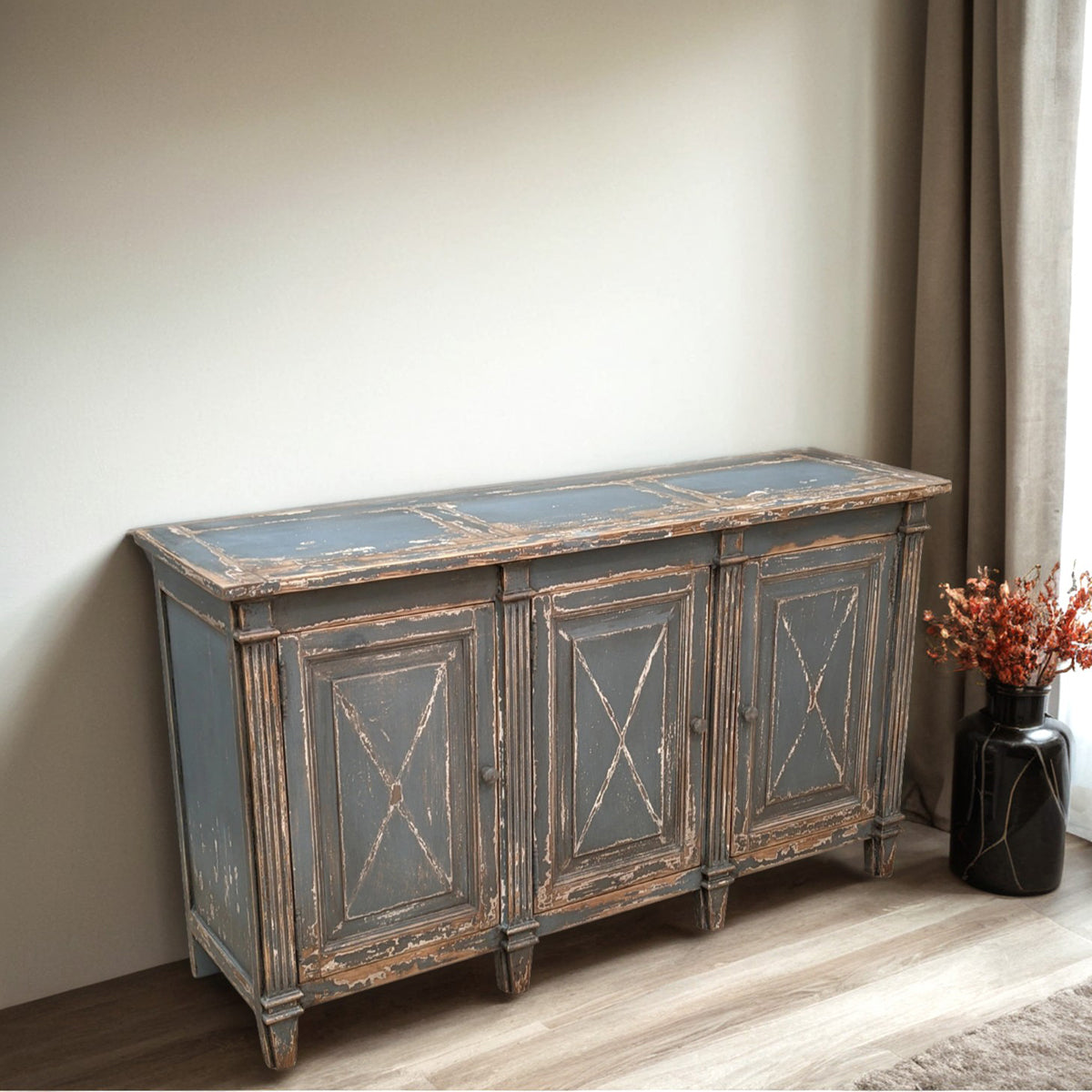 Stirling reclaimed pine sideboard with three paneled doors and cross-frame detailing