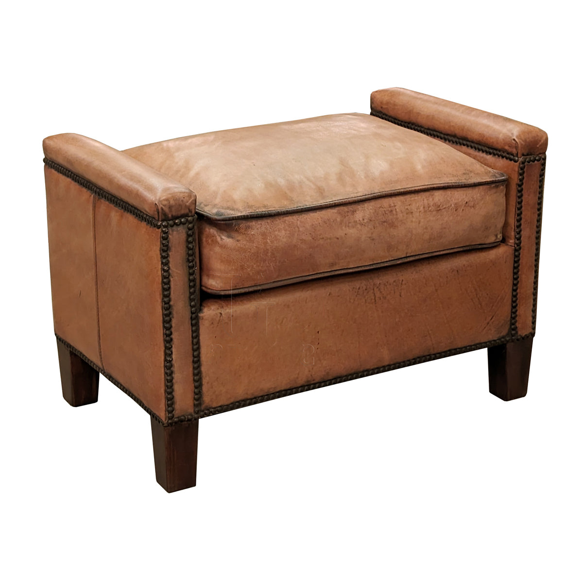 Leather ottoman with squared wood legs and nailhead trim