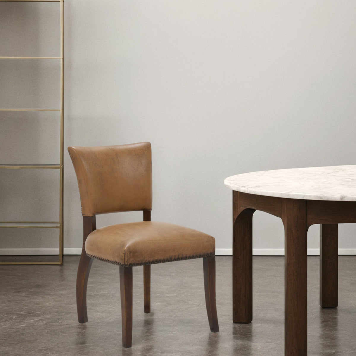 Side chair upholstered in antique buffalo leather on a birch frame