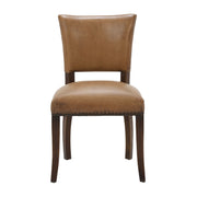 Side chair upholstered in antique buffalo leather on a birch frame