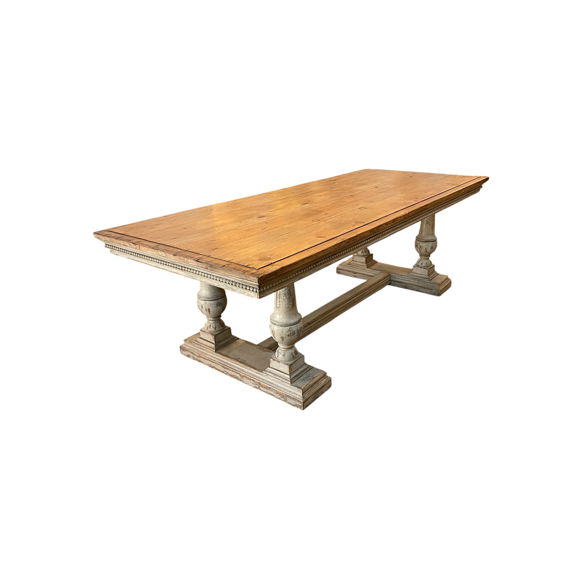 Reclaimed pine dining table with plank top and turned trestle base