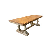 Reclaimed pine dining table with plank top and turned trestle base