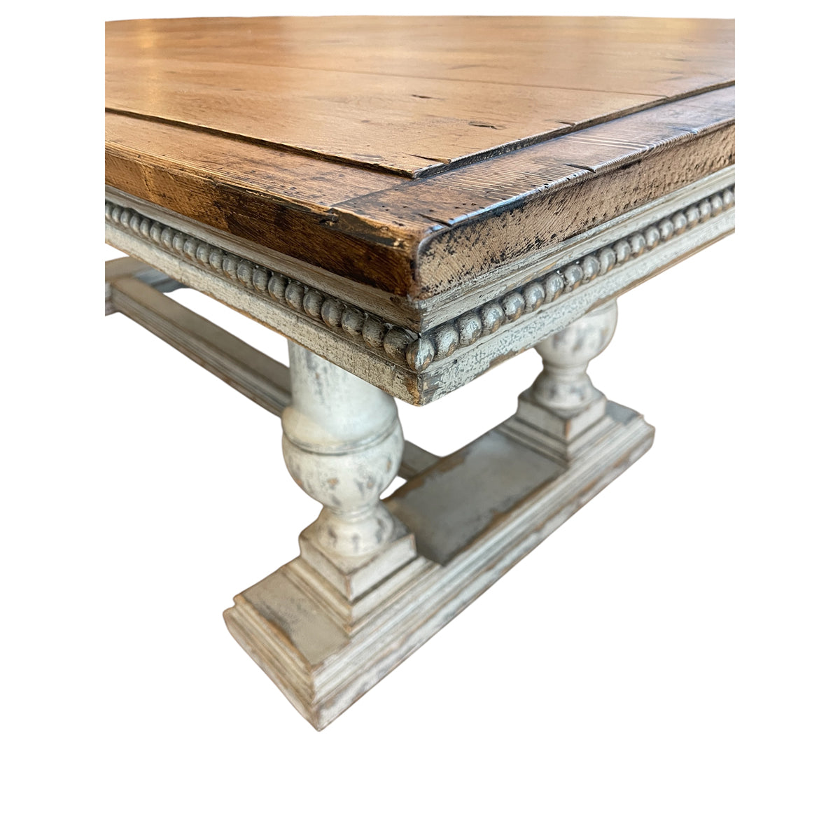 Reclaimed pine dining table with plank top and turned trestle base