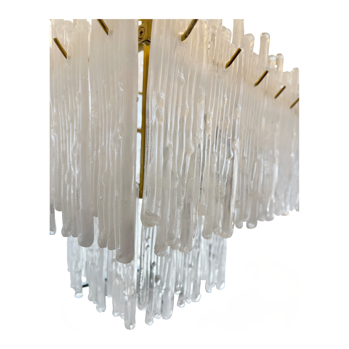 Lacy brass chandelier with dense stepped tiers of suspended glass elements
