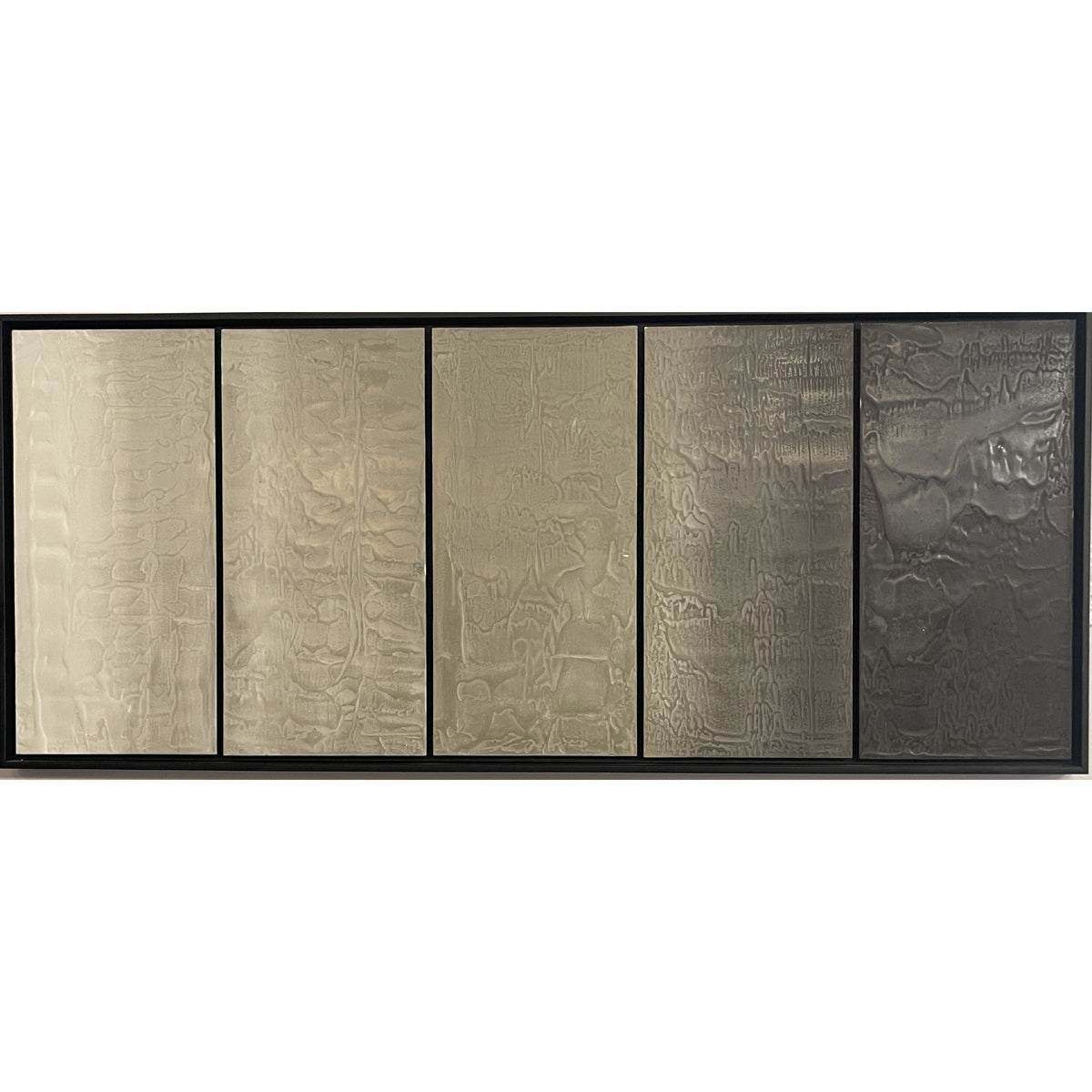 Multi-panel photographic work on a horizontal row of concrete panels