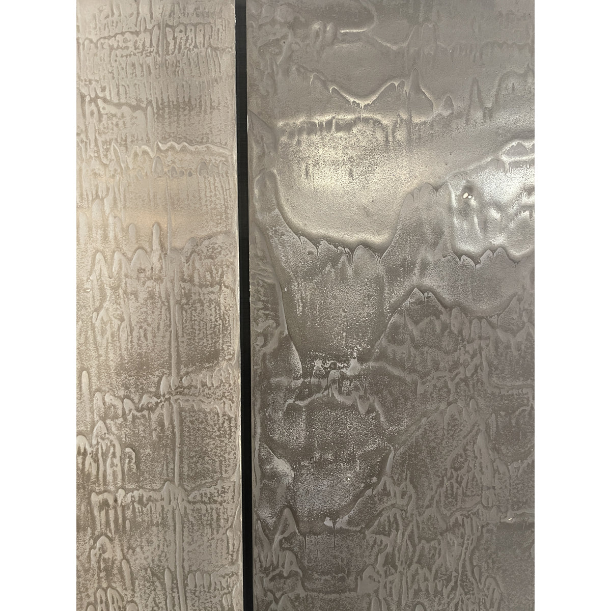 Multi-panel photographic work on a horizontal row of concrete panels
