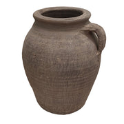 Porcelain pitcher with a rounded body and single handle