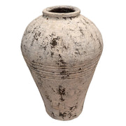 Antique ceramic pot with a rounded body and weathered surface