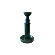 Ceramic candlestick with a vertical shaft, weighted base, and dark glaze